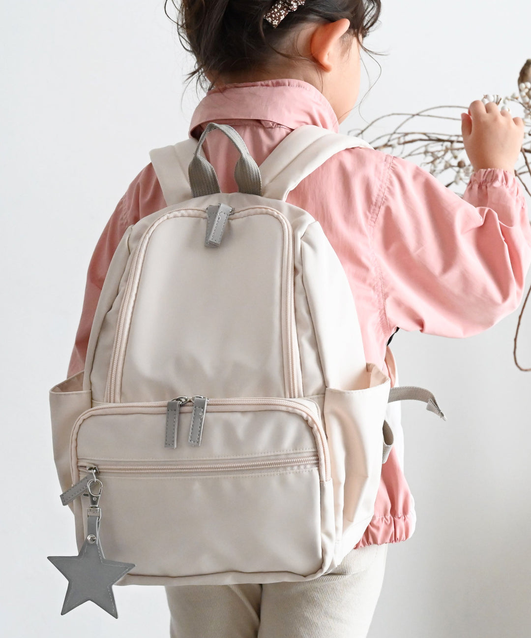 Kids' backpack with charm