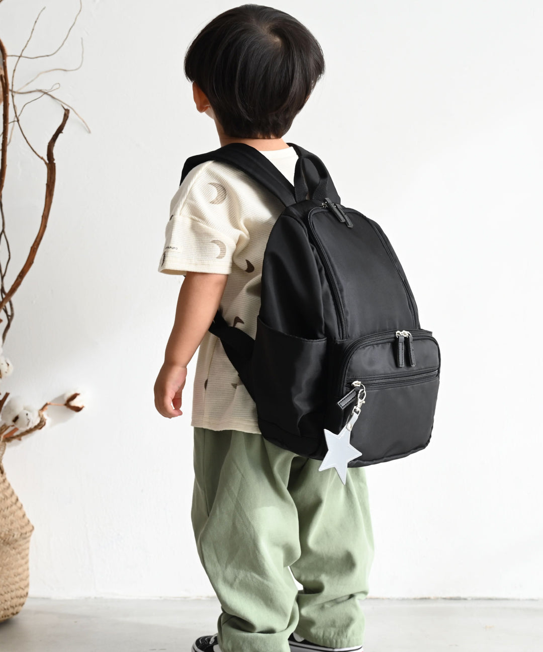 Kids' backpack with charm