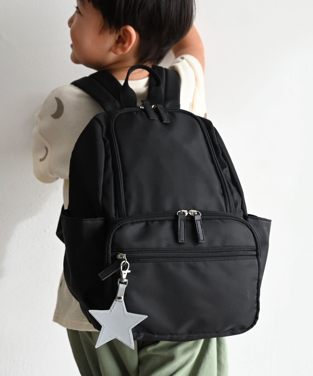 Kids' backpack with charm